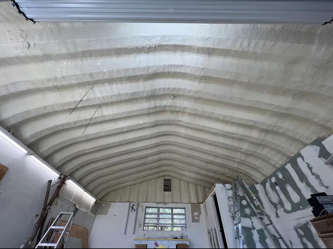 Spray polyurethane foam applied to the underside of a metal roof deck in North Hanover